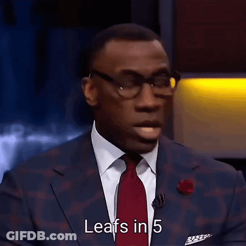 A Man In A Suit And Tie Is Talking About Leafs In 5 GIF