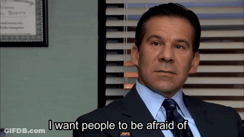 A Man In A Suit And Tie Is Talking About People GIF