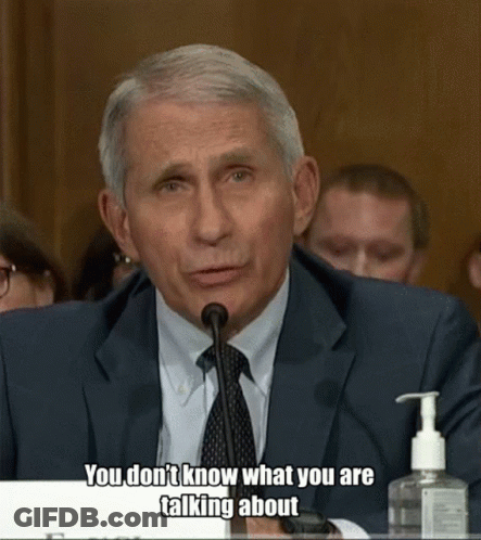 A Man In A Suit And Tie Is Talking Into A Microphone With The Words " You Don 'T Know What You Are Talking About " GIF