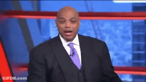 A Man In A Suit And Tie Is Talking On A Television Show GIF
