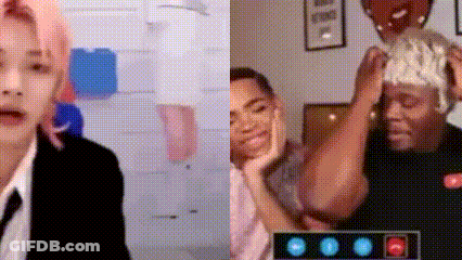A Man In A Suit And Tie Is Talking On A Video Call With Another Man . GIF