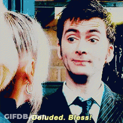 A Man In A Suit And Tie Is Talking To A Woman And Says Deluded Bless GIF