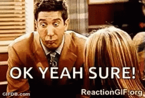 A Man In A Suit And Tie Is Talking To A Woman And Says Ok Yeah Sure GIF
