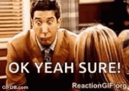 A Man In A Suit And Tie Is Talking To A Woman And Says Ok Yeah Sure GIF
