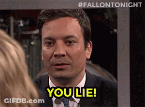 A Man In A Suit And Tie Is Talking To A Woman And Says `` You Lie '' . GIF
