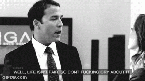 A Man In A Suit And Tie Is Talking To A Woman In A Black And White Photo . GIF
