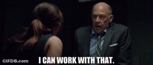 A Man In A Suit And Tie Is Talking To A Woman In A Black Dress And Says `` I Can Work With That '' . GIF