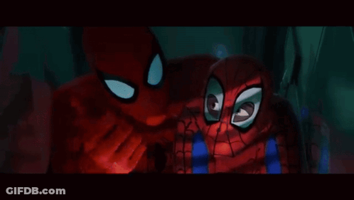A Man In A Suit And Tie Is Talking To A Woman In A Room GIF