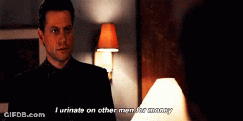 A Man In A Suit And Tie Is Talking To A Woman In A Room . GIF