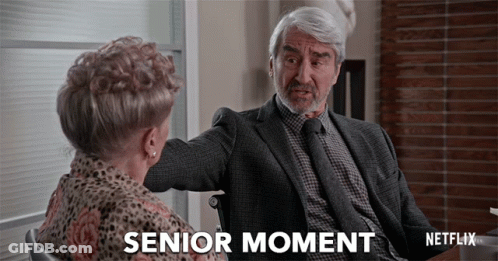 A Man In A Suit And Tie Is Talking To A Woman In A Wheelchair And The Caption Says Senior Moment GIF