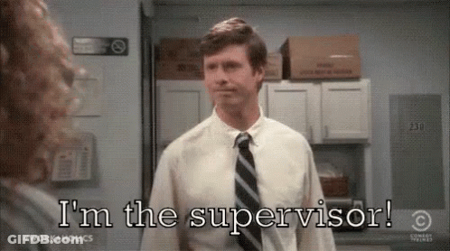 A Man In A Suit And Tie Is Talking To A Woman In An Office And Saying `` I 'M The Supervisor ! '' GIF
