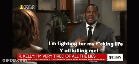 A Man In A Suit And Tie Is Talking To A Woman On Cbs GIF