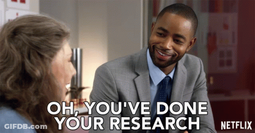 A Man In A Suit And Tie Is Talking To A Woman With The Words Oh You 'Ve Done Your Research On The Bottom GIF