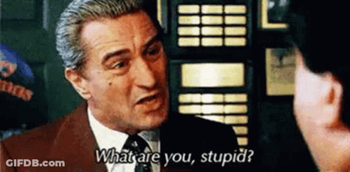 A Man In A Suit And Tie Is Talking To Another Man And Asking Him What Are You Stupid . GIF