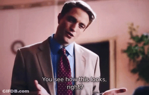 A Man In A Suit And Tie Is Talking To Another Man And Says " You See How This Looks Right " GIF