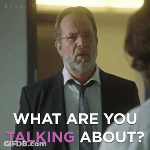 A Man In A Suit And Tie Is Talking To Another Man And The Caption Says What Are You Talking About GIF