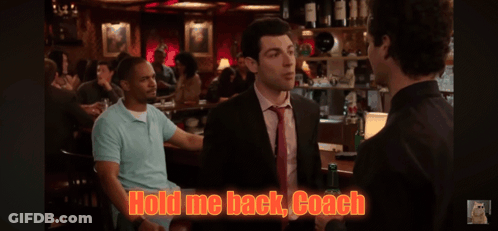 A Man In A Suit And Tie Is Talking To Another Man In A Bar With The Words Hold Me Back Coach Written On The Screen GIF