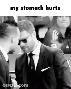 A Man In A Suit And Tie Is Talking To Another Man In A Black And White Photo . GIF