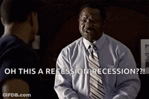 A Man In A Suit And Tie Is Talking To Another Man In A Room . GIF