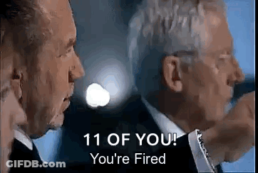 A Man In A Suit And Tie Is Talking To Another Man In A Suit . GIF