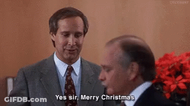 A Man In A Suit And Tie Is Talking To Another Man In A Suit And Tie . GIF