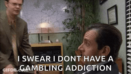 A Man In A Suit And Tie Is Talking To Another Man In A Suit And Tie In A Room . GIF