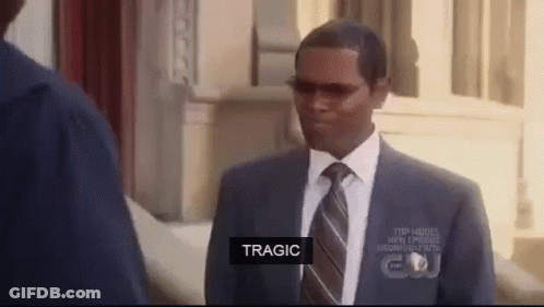 A Man In A Suit And Tie Is Talking To Another Man In A Suit And Tie . GIF