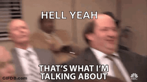 A Man In A Suit And Tie Is Talking To Another Man In A Suit . GIF