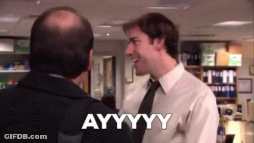 A Man In A Suit And Tie Is Talking To Another Man In An Office And Saying Ayyyyyy . GIF