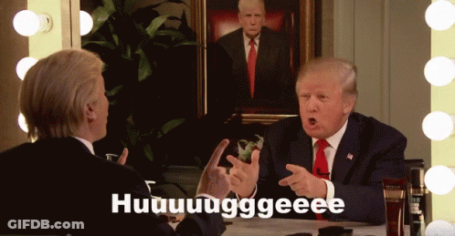A Man In A Suit And Tie Is Talking To Another Man In Front Of A Painting Of Trump GIF