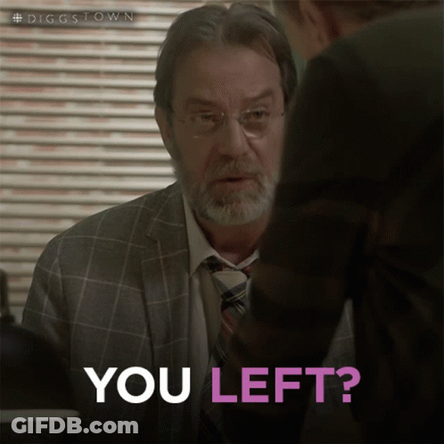 A Man In A Suit And Tie Is Talking To Another Man Who Is Asking If He Left GIF