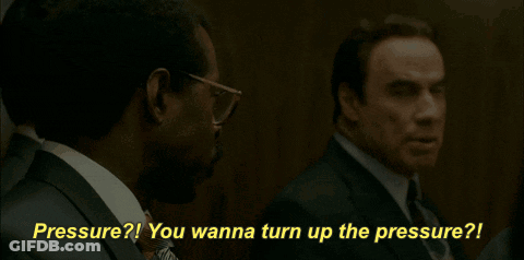 A Man In A Suit And Tie Is Talking To Another Man With The Words " Pressure You Wanna Turn Up The Pressure " Behind Him GIF