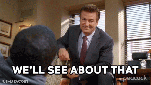 A Man In A Suit And Tie Is Talking To Another Man With The Words " We 'Ll See About That " Below Him GIF
