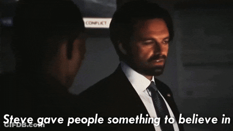 Man In Suit Talking To Another With Aspire To Text GIF