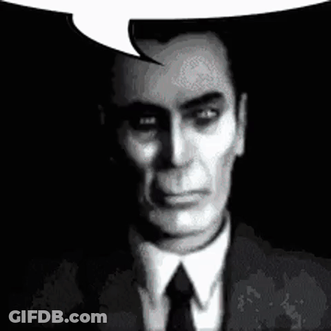 A Man In A Suit And Tie Is Talking With A Speech Bubble . GIF