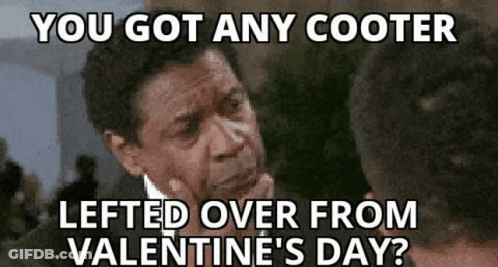 A Man In A Suit And Tie Is Thinking About Valentine 'S Day And Has Left Over From Valentine 'S Day ? GIF