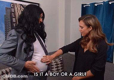 A Man In A Suit And Tie Is Touching A Pregnant Woman 'S Belly And Asking If It Is A Boy Or Girl GIF