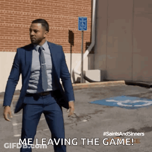 A Man In A Suit And Tie Is Walking Down A Street And Says " Me Leaving The Game " GIF