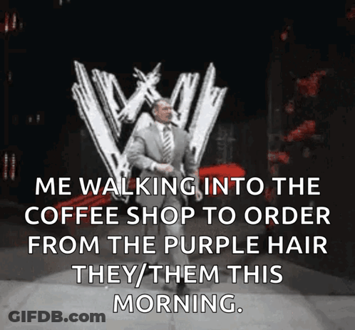 A Man In A Suit And Tie Is Walking Into A Coffee Shop GIF