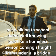A Man In A Suit And Tie Is Walking To School And Talking About A Homeless Person Coming Straight From Under A La Bridge GIF