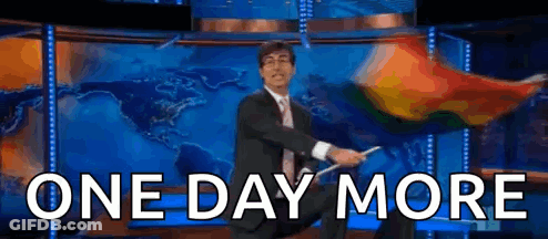 A Man In A Suit And Tie Is Waving A Flag In Front Of A Map And The Words One Day More GIF