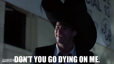 A Man In A Suit And Tie Is Wearing A Cowboy Hat And Saying " Don 'T You Go Dying On Me " GIF