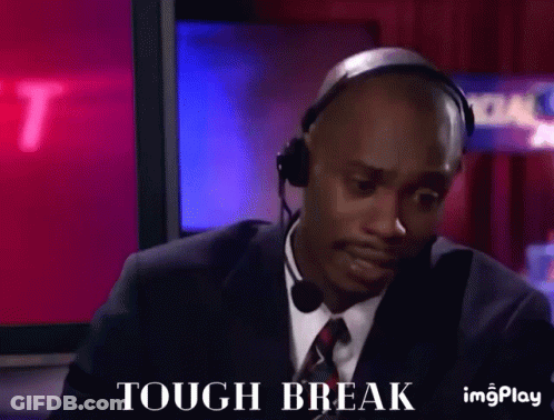 A Man In A Suit And Tie Is Wearing A Headset And Saying Tough Break GIF