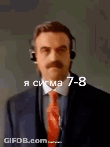 A Man In A Suit And Tie Is Wearing A Headset And The Number 7-8 Is Above Him GIF