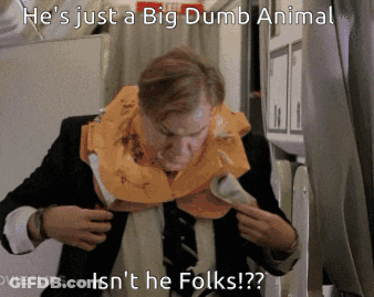 A Man In A Suit And Tie Is Wearing A Life Vest Around His Neck GIF