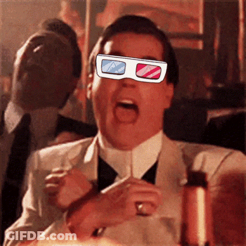 A Man In A Suit And Tie Is Wearing A Pair Of 3D Glasses On His Face GIF