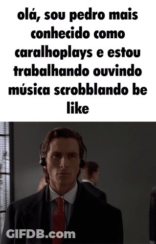 A Man In A Suit And Tie Is Wearing Headphones And Says " Olá " GIF