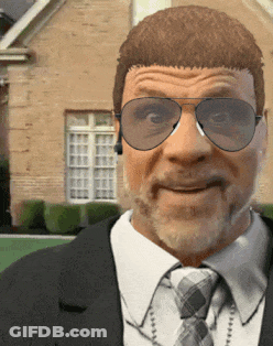 A Man In A Suit And Tie Is Wearing Sunglasses And Headphones GIF