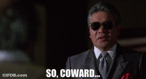 A Man In A Suit And Tie Is Wearing Sunglasses And Saying `` So , Coward . '' GIF