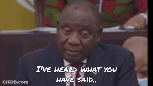 A Man In A Suit And Tie Is Wearing Sunglasses With The Word Fokol Written On The Bottom GIF